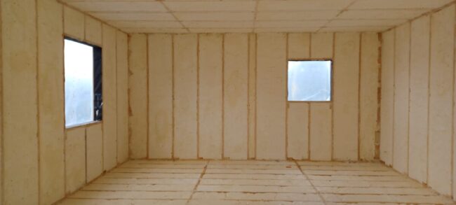 Isolation avec mousse projetée d'une maison à ossature à Hastière