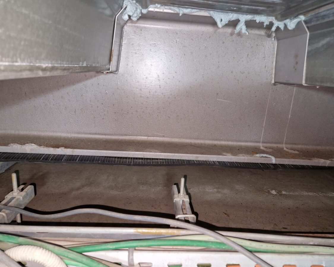 Isolation sous-poutre métallique par mousse projetée à l'Abbaye d'Orval