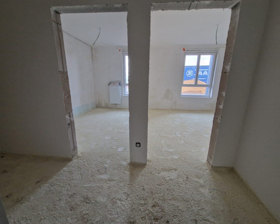 Isolation acoustique projetée sous chape pour immeubles résidentiels publics