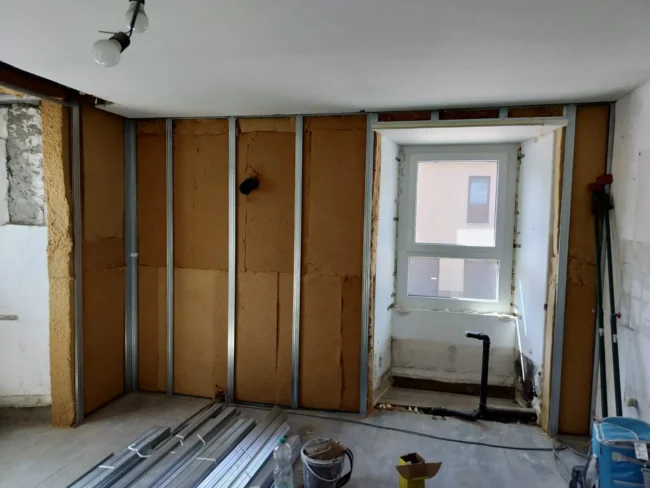 Isolation des murs d'un appartement à Martelange